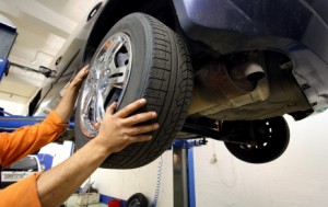mechanic changing a car wheel.
